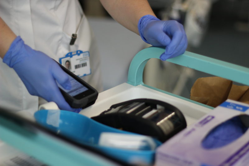 Nurses hand holding digital device 